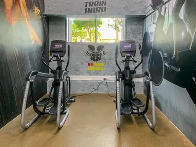 two exercise bikes in a gym with a window at Modern High Floor Canal View1 BHK in Dubai