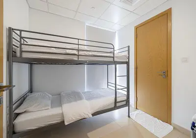 a room with two bunk beds in a room at Magnificent 4 Bedroom Apartment, Bellevue Tower in Dubai