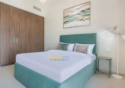 a bedroom with a large bed in a room at Luxurious 1 Bed in Dubai Creek Harbor, Hosted by Desert City Stays in Dubai