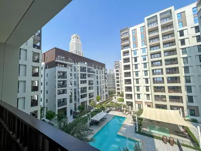 a view from the balcony of a building with a swimming pool at Elegant 1 Bedroom at Creek Beach Bayshore in Dubai