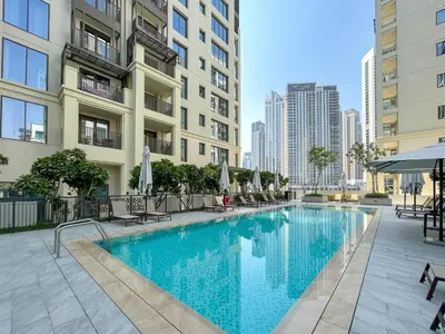 a swimming pool in the middle of a building at Elegant 1 Bedroom at Creek Beach Bayshore in Dubai