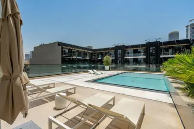 a swimming pool on the roof of a building at GuestReady - Charming haven at Binghatti Crest in Dubai