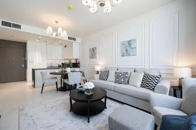 a living room with a couch and a table at Crystal Lagoon View Beach access Fast Wi-Fi in Dubai