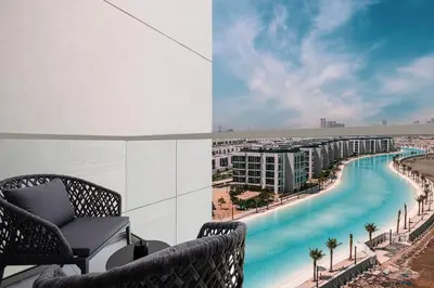 a view from the balcony of a resort with a pool at Crystal Lagoon View Beach access Fast Wi-Fi in Dubai