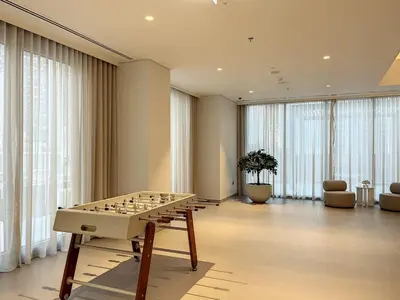 a living room with a chess board on a table at Forte Tower 2 - Warm Two Bedroom in Dubai