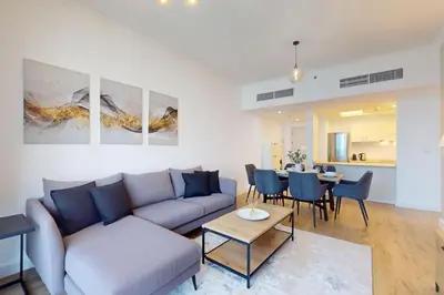 a living room with a couch and a table at Bay Central - Enticing Two Bedroom in Dubai