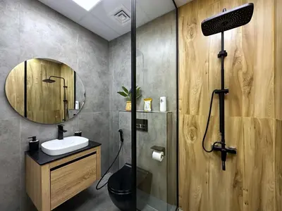 a bathroom with a shower and a sink and a mirror at Ultra Luxury Flat Fully Upgrade with Balcony in Marina in Dubai