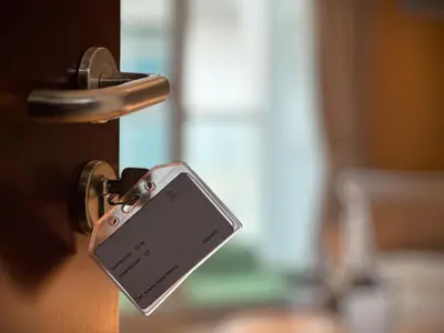 a door latch with a cell phone attached to it at Ultra Luxury Flat Fully Upgrade with Balcony in Marina in Dubai