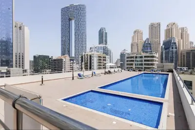 a swimming pool on the roof of a building at Ultra Luxury Flat Fully Upgrade with Balcony in Marina in Dubai