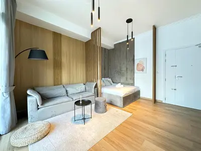 a living room with a couch and a table at Ultra Luxury Flat Fully Upgrade with Balcony in Marina in Dubai