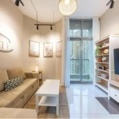 a living room with a couch and a table at Best Spot in Marina Dubai in Dubai