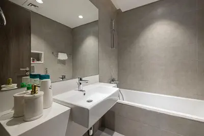 a bathroom with a sink and a bath tub at Full Lagoon View Beach Access Exclusive building in Dubai