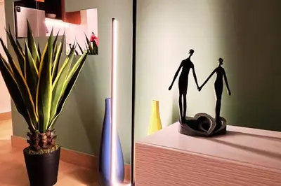 a figurine of a couple holding hands next to a plant at Full Seaview Comfortable Apt La Mer Dubai in Dubai