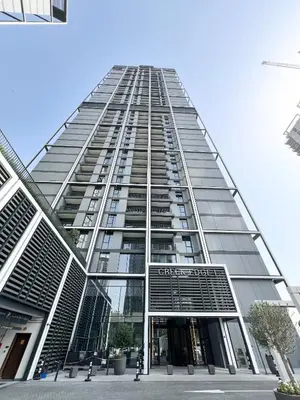 a tall building with a lot of windows at Elegant 1 bedroom in Creek Edge in Dubai