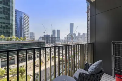a balcony with a view of a city at Studio Chic In Business Bay With Pool and Gym in Dubai
