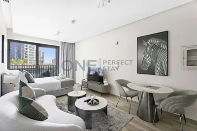 a living room with a zebra picture on the wall at Studio Chic In Business Bay With Pool and Gym in Dubai
