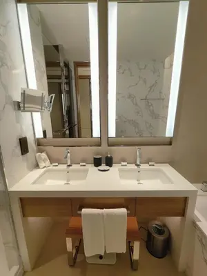 a bathroom with two sinks and a large mirror at 2BD Luxury Opera District Apt Downtown in Dubai