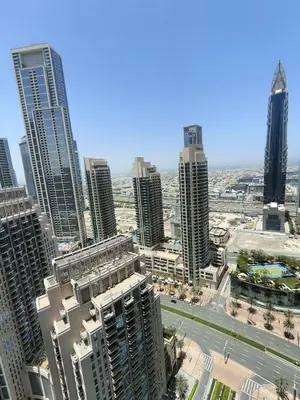 an aerial view of a city with tall buildings at 2BD Luxury Opera District Apt Downtown in Dubai