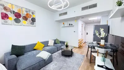 a living room with a couch and a table at Dubai Marina - Modern Design Studio Apartment, Marina Diamond 2 in Dubai