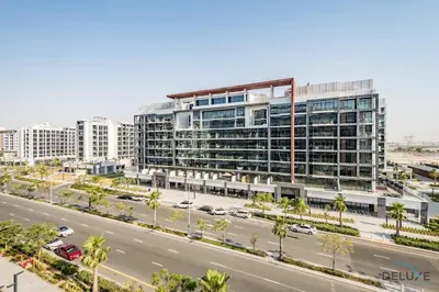 an office building with a road in front of it at Alluring Studio Apartment at Azizi Riviera 16, Al Merkadh by Deluxe Holiday Homes in Dubai