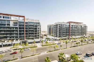 an aerial view of a city with tall buildings at Alluring Studio Apartment at Azizi Riviera 16, Al Merkadh by Deluxe Holiday Homes in Dubai