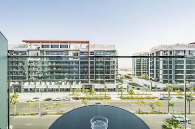 a view of a parking lot with buildings at Alluring Studio Apartment at Azizi Riviera 16, Al Merkadh by Deluxe Holiday Homes in Dubai
