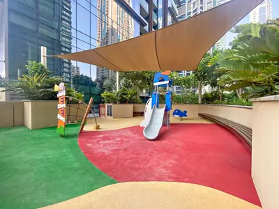 a childrens play area with a slide and a playground at Chic 1-Bed Near Marina Promenade - 5 min to Tram in Dubai