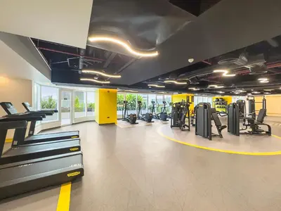 a gym with treadmills and cardio equipment in a building at Big Studio - WOW facilities in Dubai