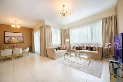 a living room with a couch and a table at Stunning Marina view apartment In Marina sail tower by Truebleu vacation homes in Dubai