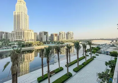 a view of a city with palm trees and buildings at 2-BR Getaway at Palace Residences, Dubai Creek in Dubai