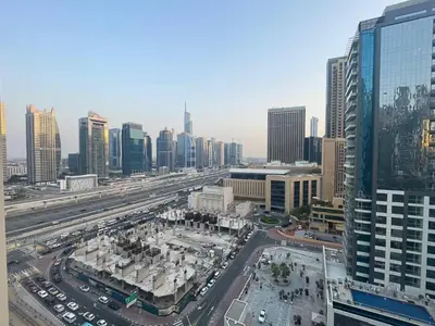 an aerial view of a city with buildings and traffic at Very Convenient Apartment steps to Metro and Marina Mall Managed by SunnyHomes in Dubai