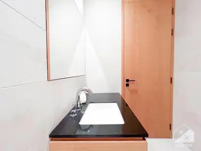 a bathroom with a sink and a mirror at Stylish One-Bedroom Getaway in Business Bay in Dubai