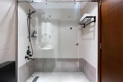 a shower with a glass door in a bathroom at Downtown,Fountain view, nearBurj Khalifa,3 minutes walk to Dubai Mall in Dubai