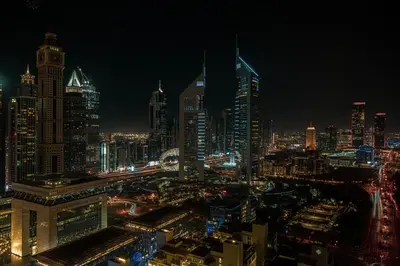 a night view of a large city at night at Heart of DIFC 1 BR LUX - Exceptional View in Dubai