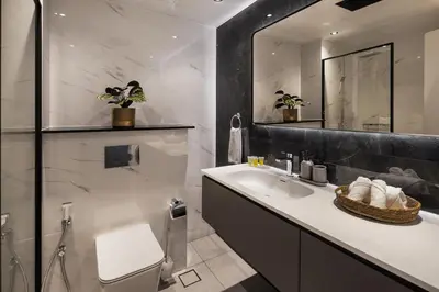 a bathroom with a sink and a mirror at Chic studio near metro at Discovery Gardens in Dubai