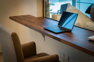 a laptop computer sitting on top of a wooden table at Vacation Friendly Beach View Luxury 1Bedroom- Walk To Beach & Mall in Dubai