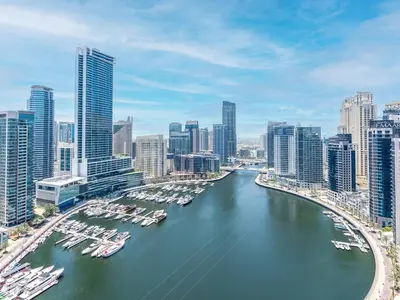 an aerial view of a city with boats in the water at 2 Bedroom Smart Home with a Panoramic Marina View in Dubai
