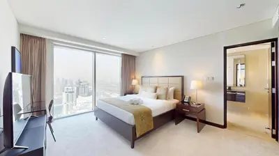 a hotel room with a bed and a large window at Vacationer l Bright 1 Bedroom l Marina & Yacht Views l Pool access & Free Wi-Fi in Dubai