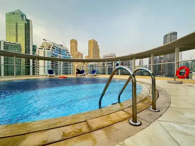 a swimming pool on the roof of a building at Amazing Roof Top Pool in Nice 1 BHK Flat in Marina in Dubai