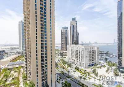 an aerial view of a city with tall buildings at Luxurious 2 BR- Dubai Creek Harbour - Host & Stay in Dubai