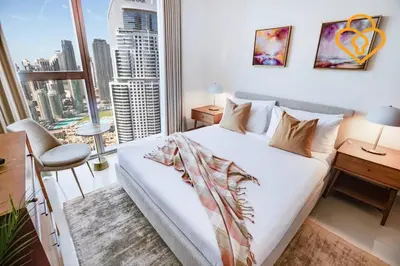 a bedroom with a large bed and a large window at Keysplease 3 BR Burj View, Dubai Mall Access Boulevard Point Tower in Dubai