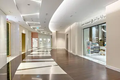 a hallway in a shopping mall with a store at Downtown 2BR Skyline Views & Prime Dubai Stay Near Burj Khalifa, Mall in Dubai