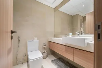 a bathroom with a sink and a toilet at StoneTree - Fully Furnished - Brand New in Dubai