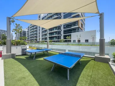 two ping pong tables on the roof of a building at StoneTree - Fully Furnished - Brand New in Dubai