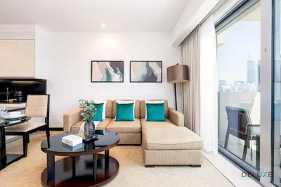 a living room with a couch and a table at Charming 1BR in The Address Residences Dubai Marina by Deluxe Holiday Homes in Dubai