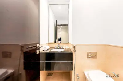 a bathroom with a sink and a mirror at Charming 1BR in The Address Residences Dubai Marina by Deluxe Holiday Homes in Dubai