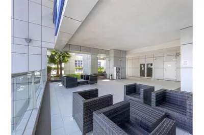 a view of the lobby of a building with chairs and tables at HAVN - 1 Bedroom in Dubai Marina with Sea Views in Dubai