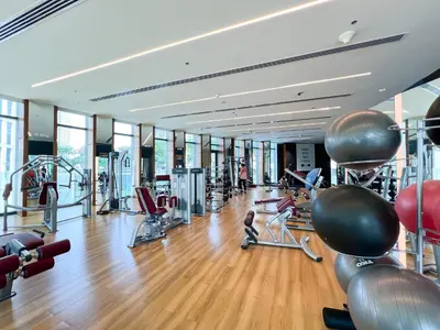 a gym with exercise equipment and people in it at Stylish 2BR Burj Khalifa & Fountain View Downtown - 37AB06 in Dubai