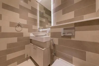 a bathroom with a sink and a toilet in it at Palm Jumeirah 1BR - Rooftop Infinity Pool in Dubai