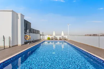 a swimming pool on the roof of a building at Fantastic1BR Furnished Apt at Azizi Park Avenue! in Dubai
